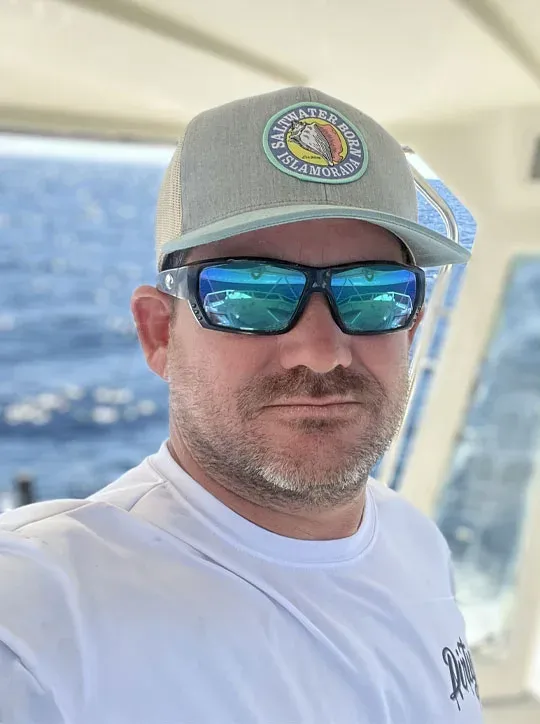Captain Kit Carson — Islamorada fishing guide, USCG-licensed, Keys Weekly Best Fishing Guide 2023, on the bridge of DirtyBoat 2.0 at Robbie's Marina