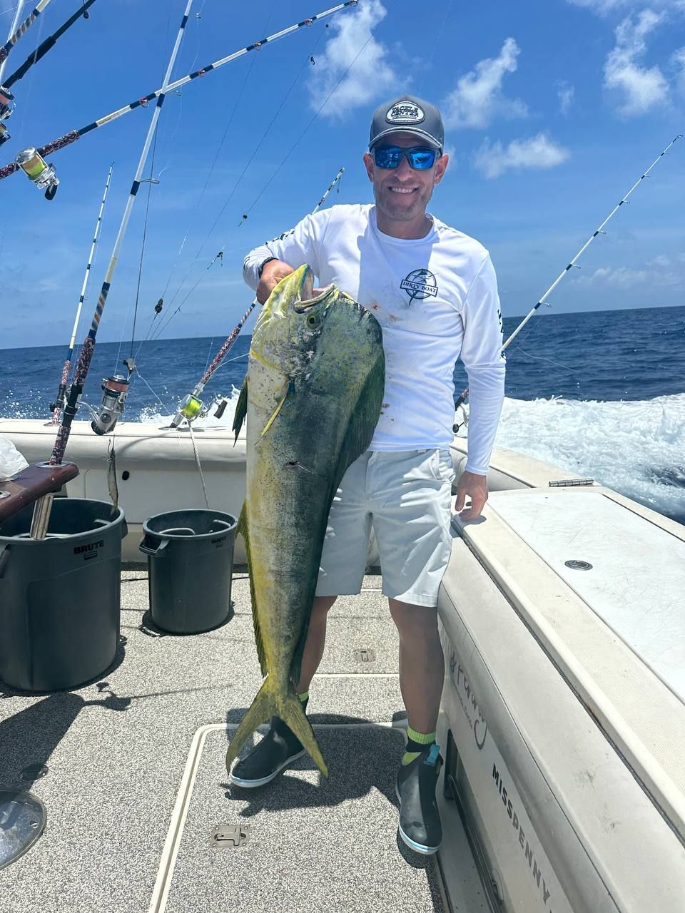 Angler holding a bull mahi-mahi (dolphin) caught offshore of Islamorada